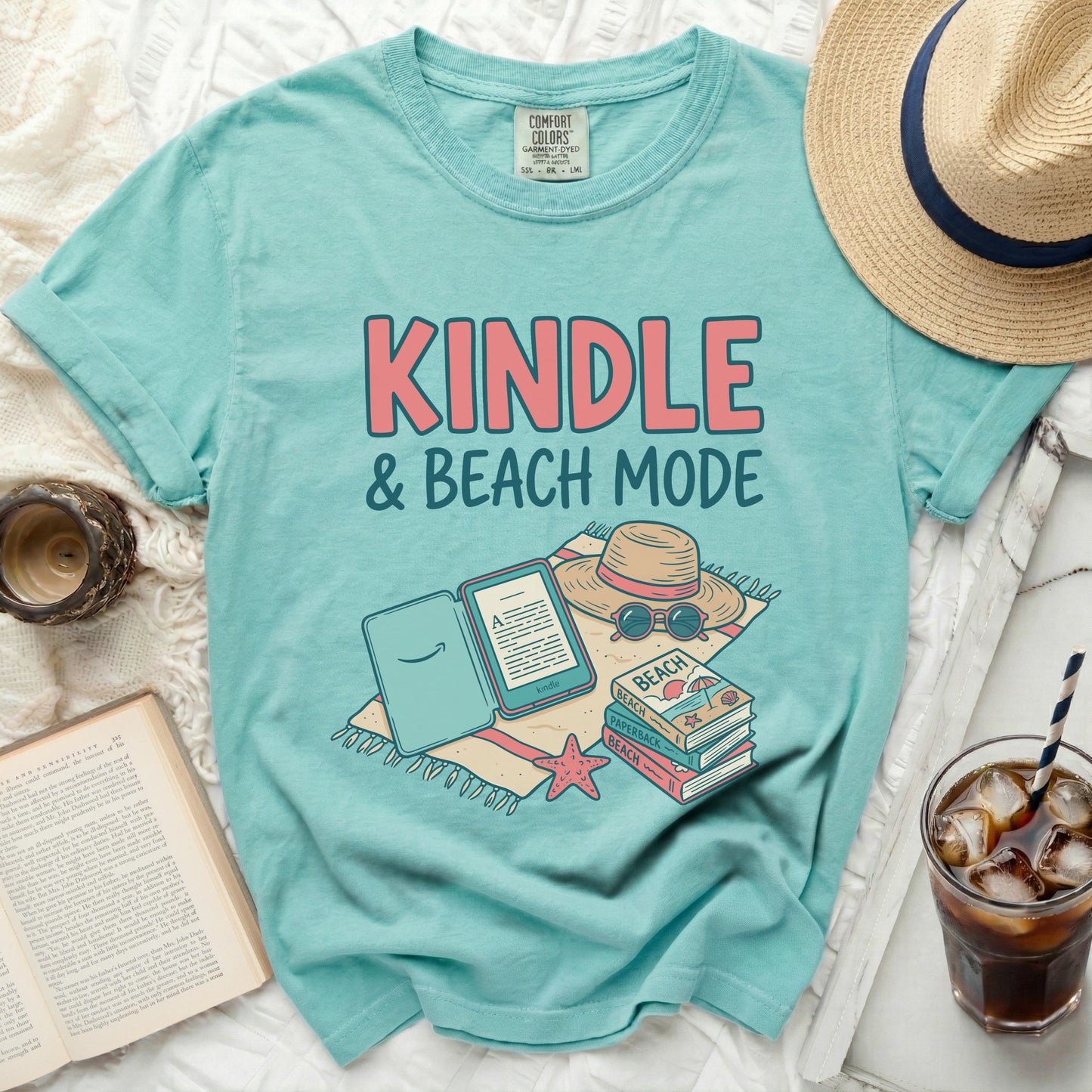 Teal t-shirt with "KINDLE & BEACH MODE" and book illustrations.