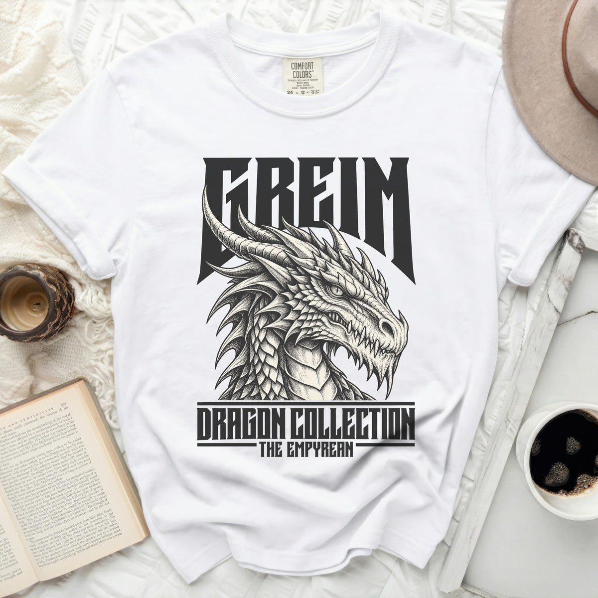 White t-shirt with a black and white dragon graphic and text.