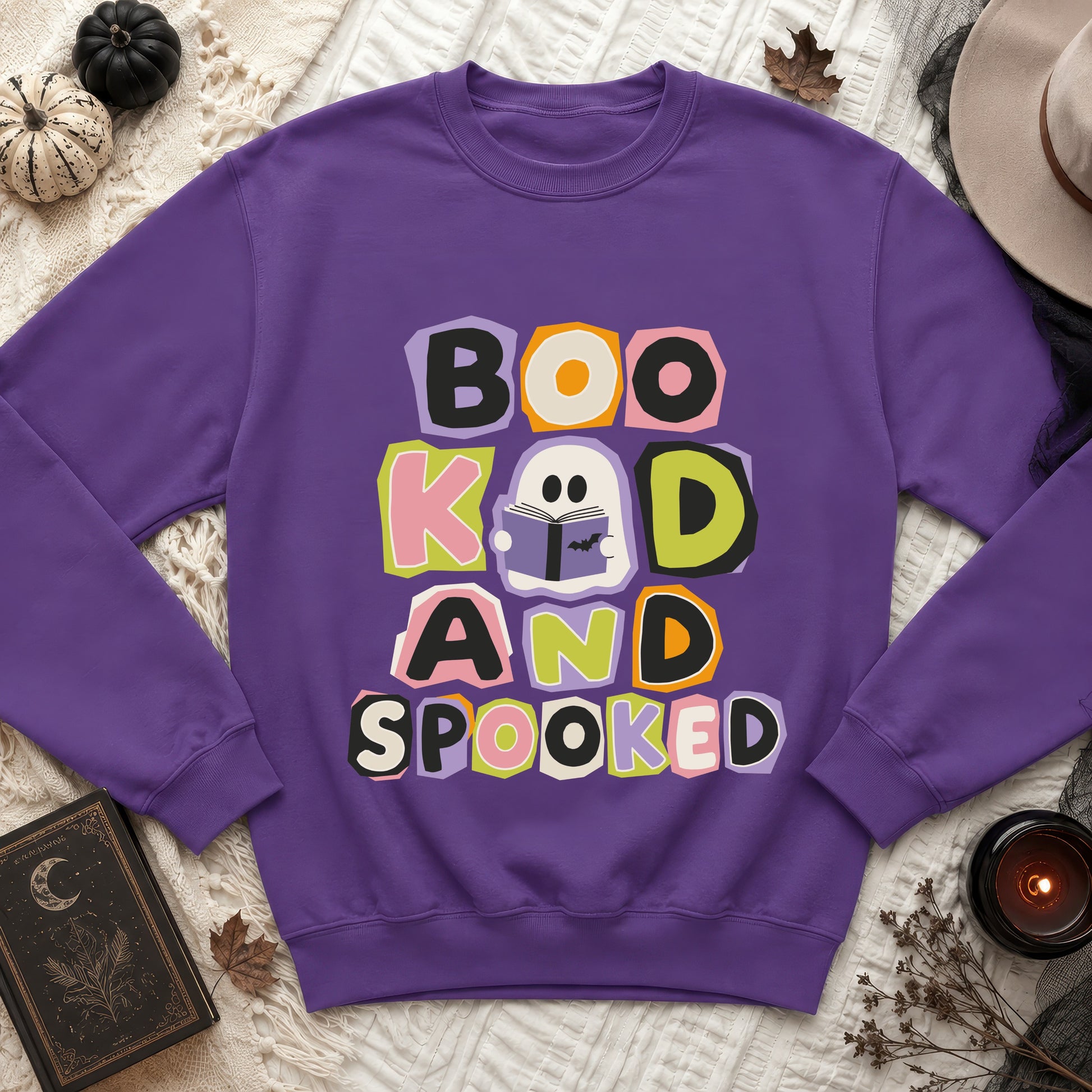 Purple sweatshirt with "Boo, Knew, and Spooked" text and a reading ghost graphic.