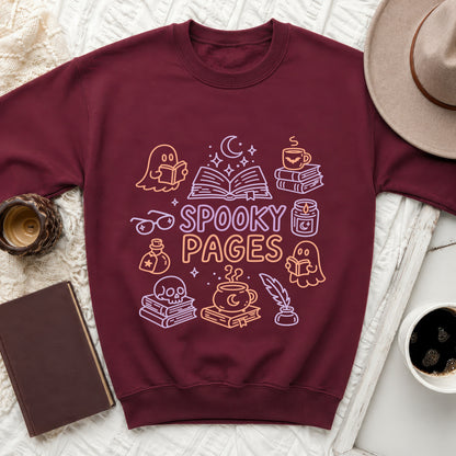 Maroon sweatshirt with whimsical ghost, book, and cauldron graphic reading "Spooky Pages".