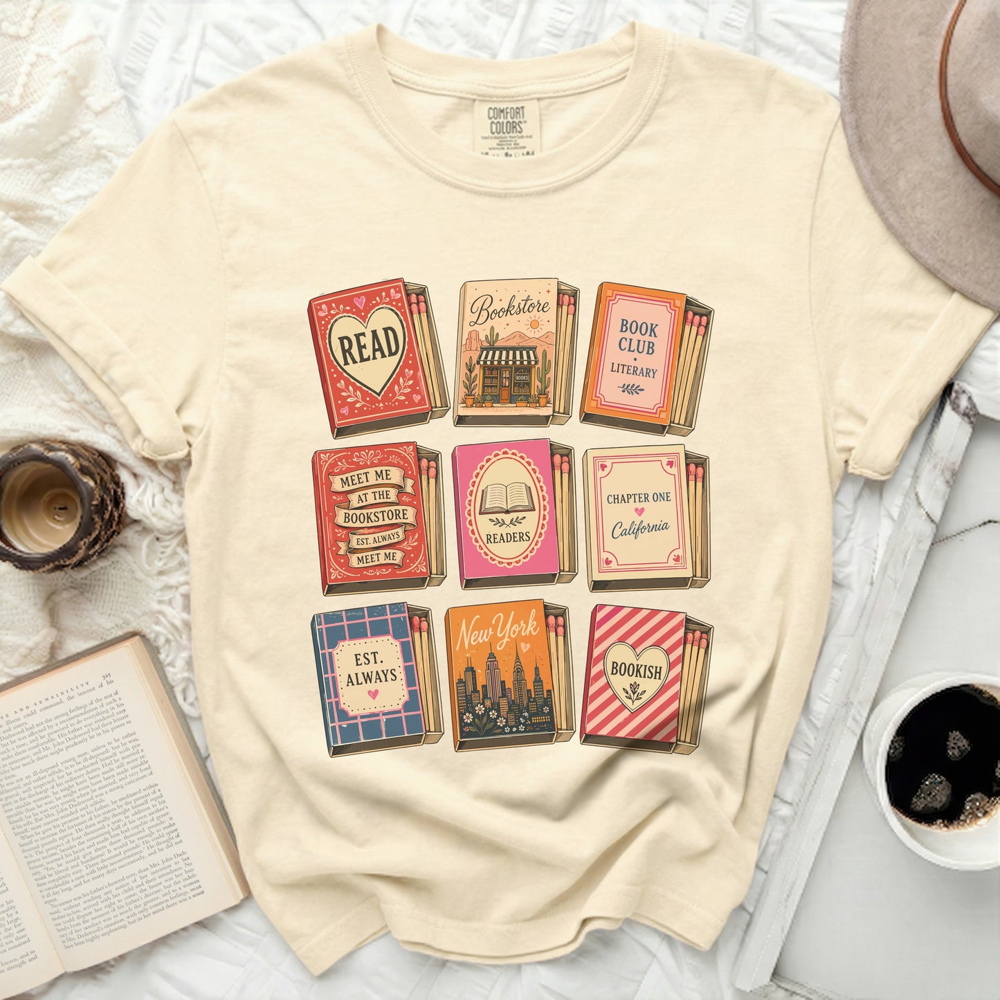 T-shirt with matchbook designs featuring book-related text and city names.