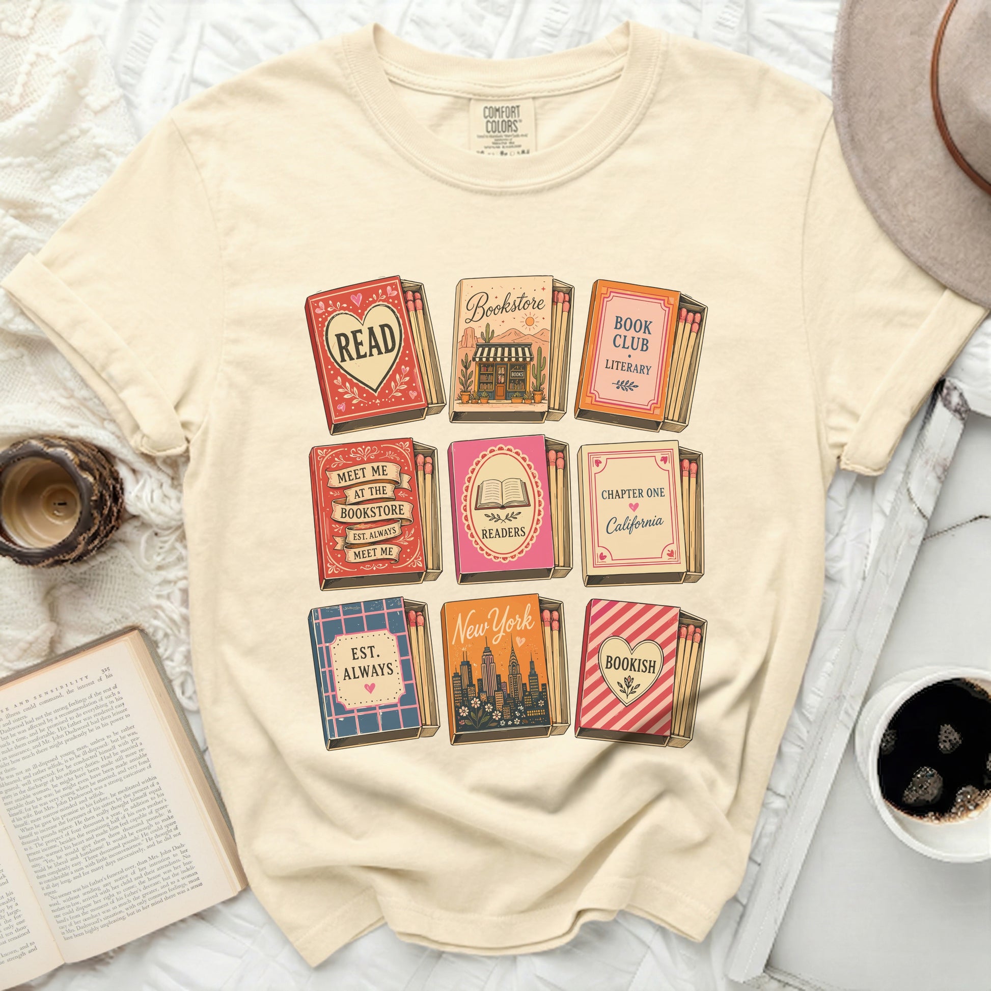 T-shirt with matchbook designs featuring book-related text and city names.