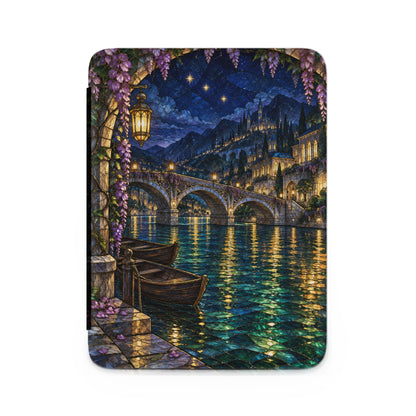 Stained glass scene of a bridge over water with boats and a city at night.