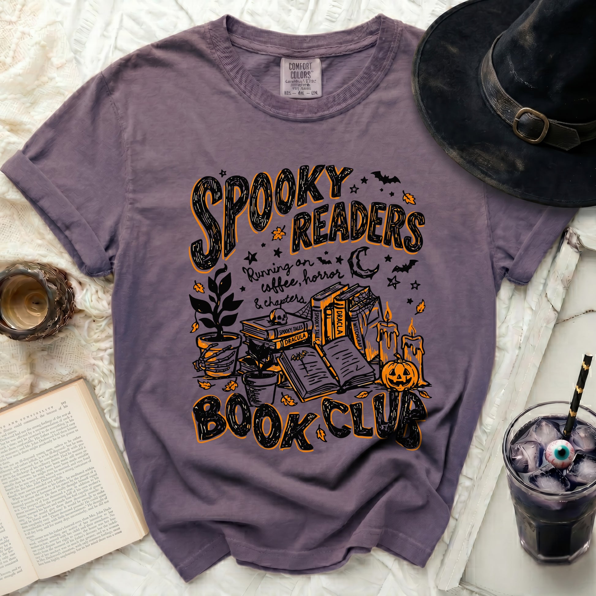 Purple t-shirt with "Spooky Readers Book Club" Halloween graphic.