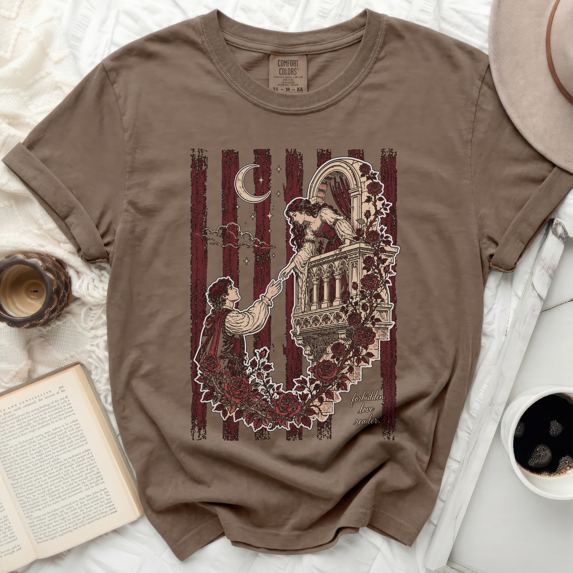 Brown t-shirt with Romeo and Juliet balcony scene illustration and text.