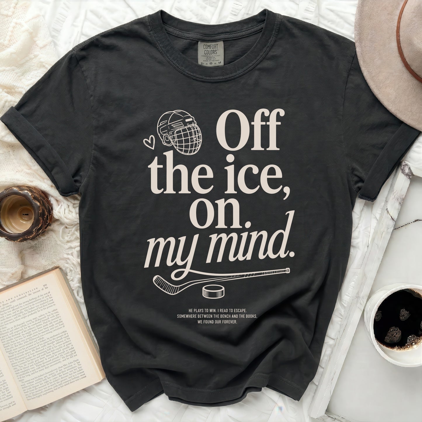 Black t-shirt with "Off the ice, on my mind." text and hockey graphics.