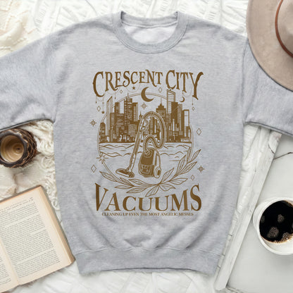 Gray sweatshirt with "Crescent City Vacuums" graphic and vacuum cleaner illustration.