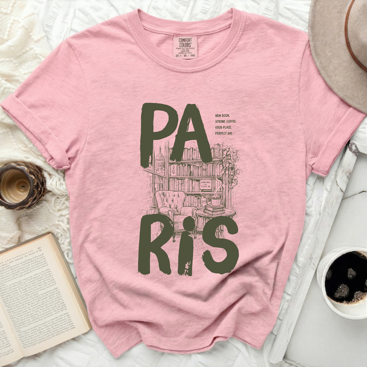 Pink t-shirt with graphic "PA RIS" and library scene.