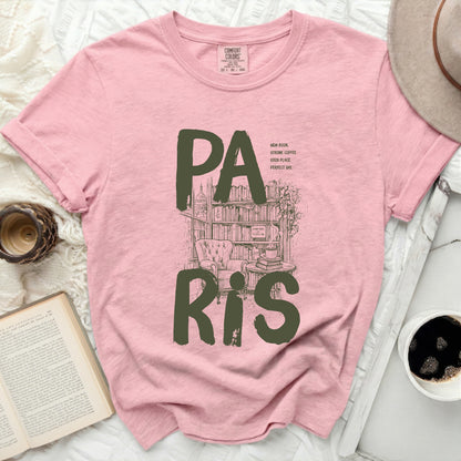 Pink t-shirt with graphic "PA RIS" and library scene.