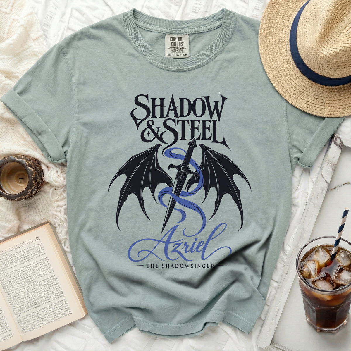 Light blue t-shirt with "Shadow & Steel Azriel The Shadowsinger" graphic.