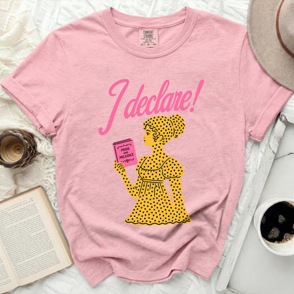 Pink t-shirt with "I declare!" and a yellow figure holding Pride and Prejudice.