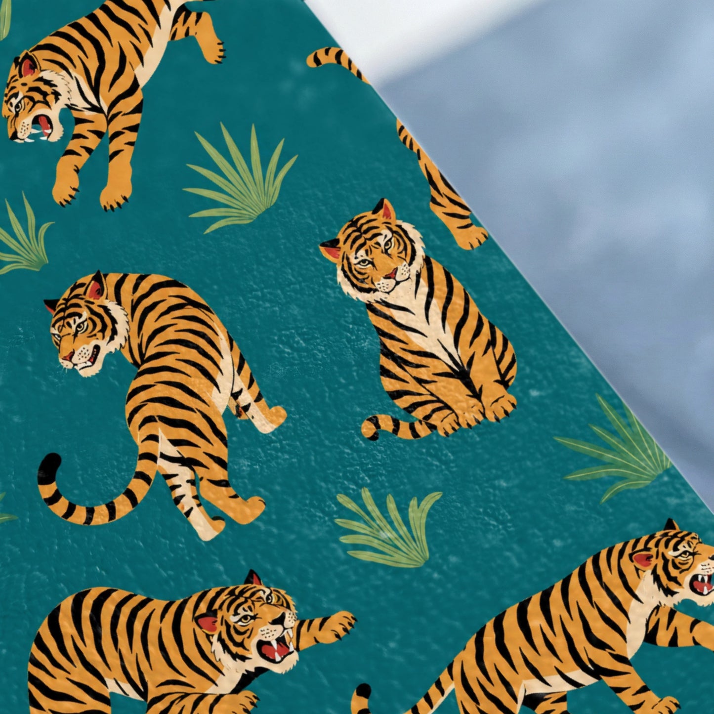 Various tigers on a textured teal background with green foliage elements.