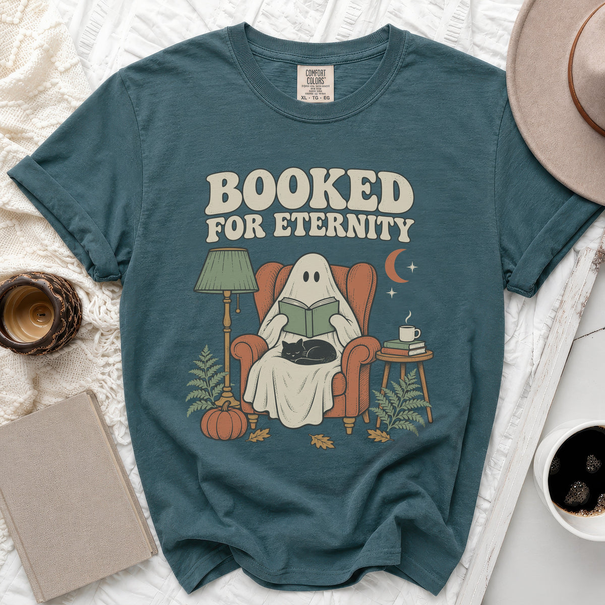 Ghost reading a book with cat, "Booked for Eternity" text, autumn scene.