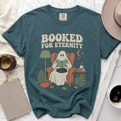 Ghost reading a book with cat, "Booked for Eternity" text, autumn scene.