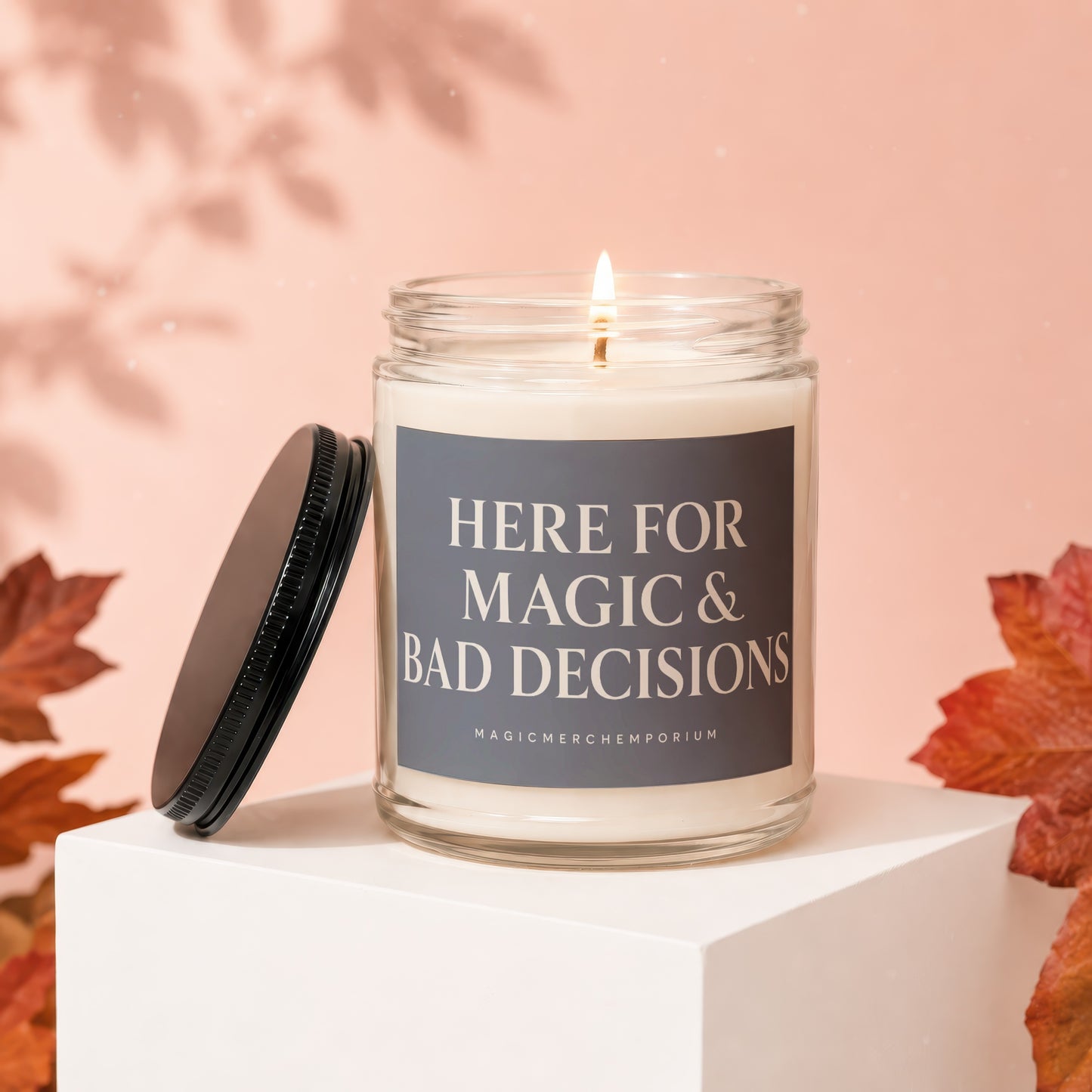 White candle in a glass jar with text "HERE FOR MAGIC & BAD DECISIONS".