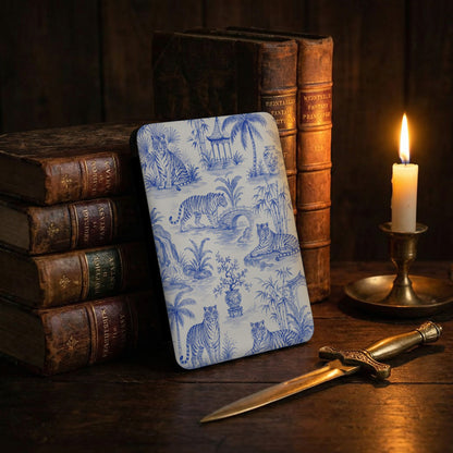 Blue and white toile pattern with tigers, pagodas, and tropical plants on a book cover.