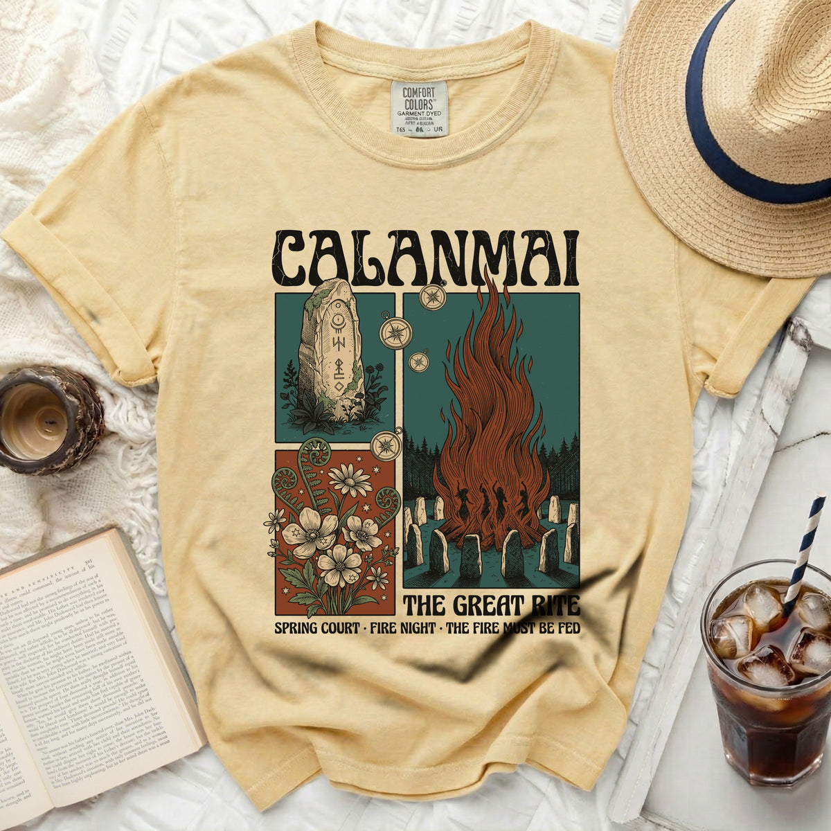 Yellow t-shirt with "Calamai The Great Rite" graphic of fire and stones.