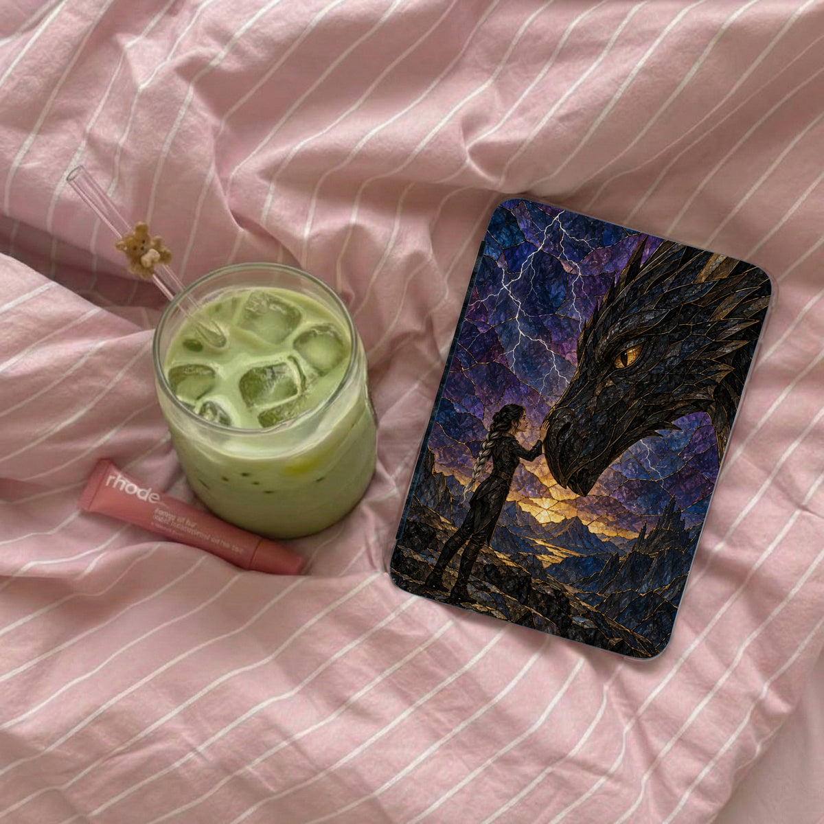 Phone case featuring a woman touching a dragon's head against a stormy, mountainous landscape.