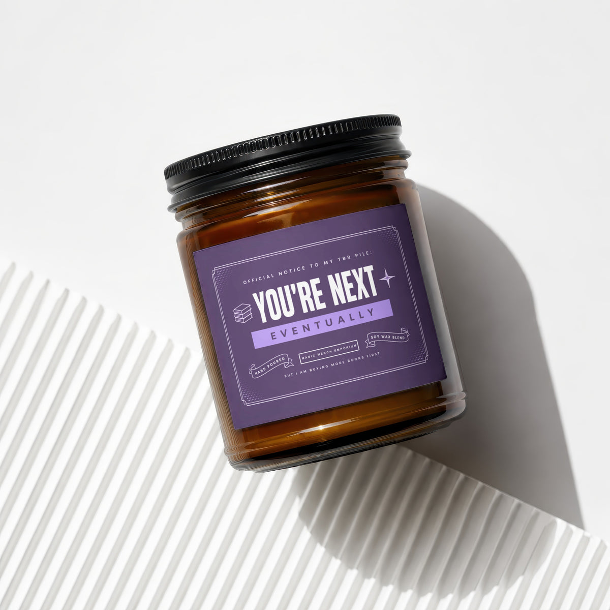 Candle labeled "You're Next Eventually" with "Official Notice to My TBR Pile".