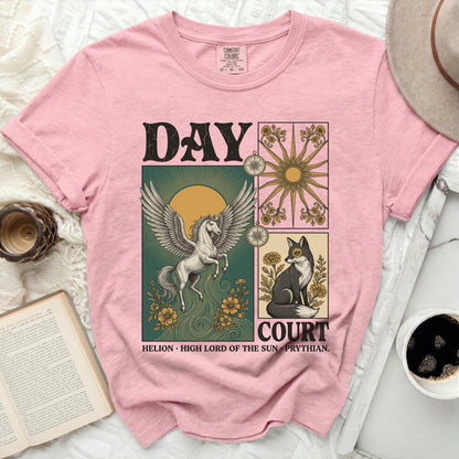 Pink t-shirt with a graphic of a Pegasus, sun, compass, and fox, with text.
