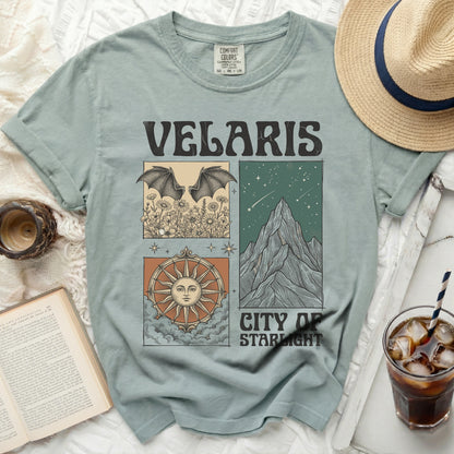 Velaris City of Starlight graphic tee with bats, flowers, mountains, and sun designs.