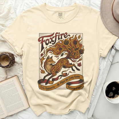 Cream t-shirt with a "Foxfire" design of a fox, flames, and roses.