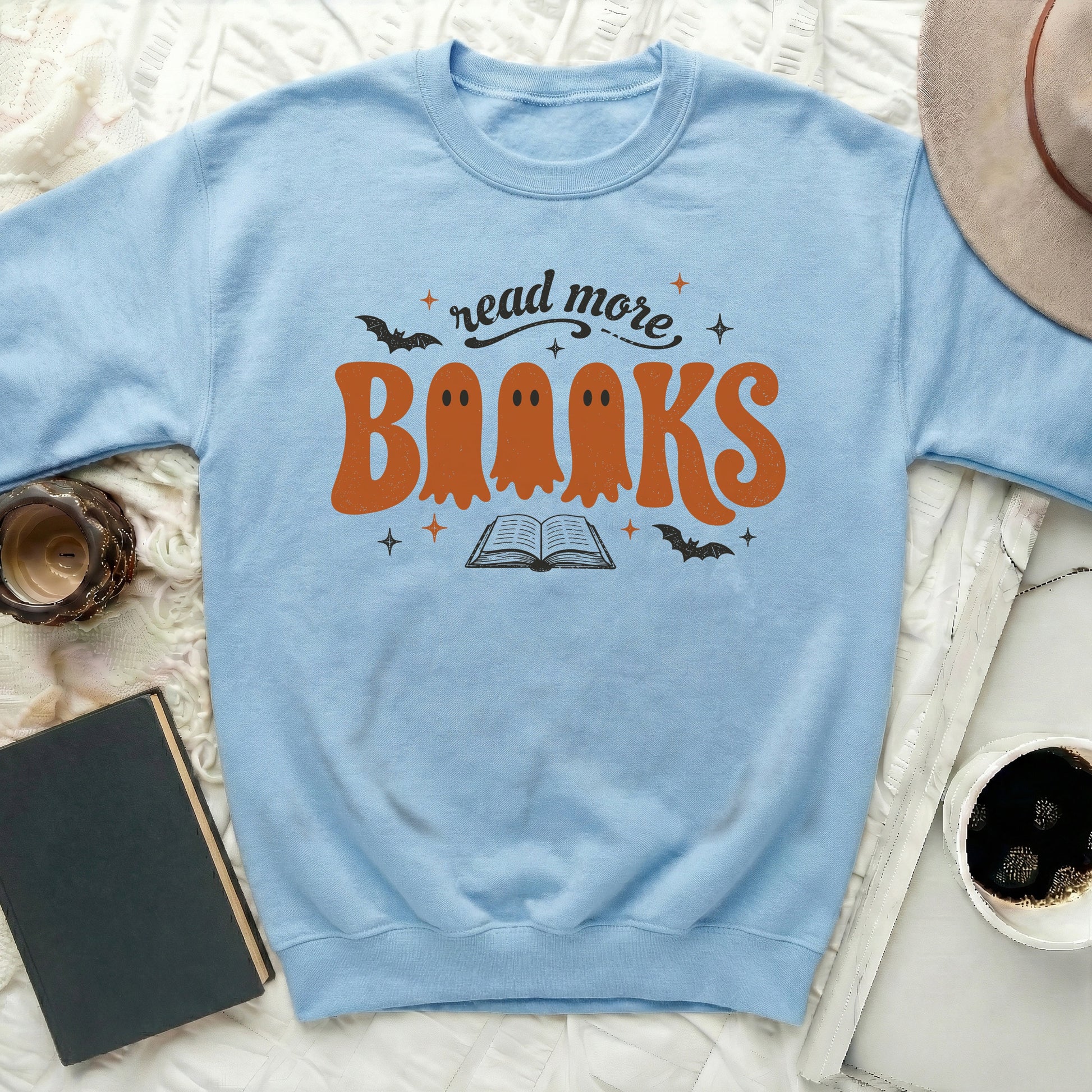 Light blue sweatshirt with "read more Books" and ghost design.