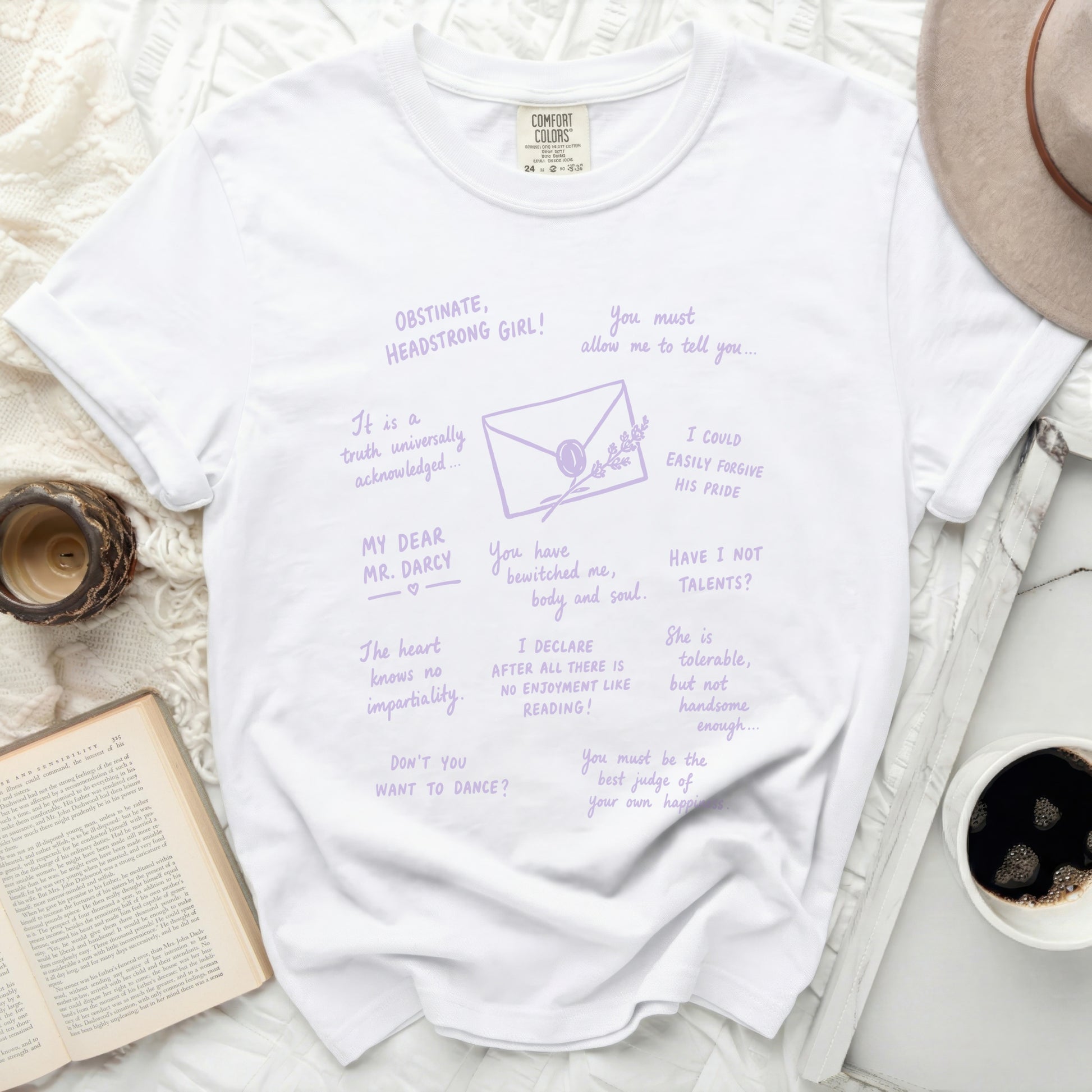 White t-shirt with purple text and drawings inspired by Jane Austen.