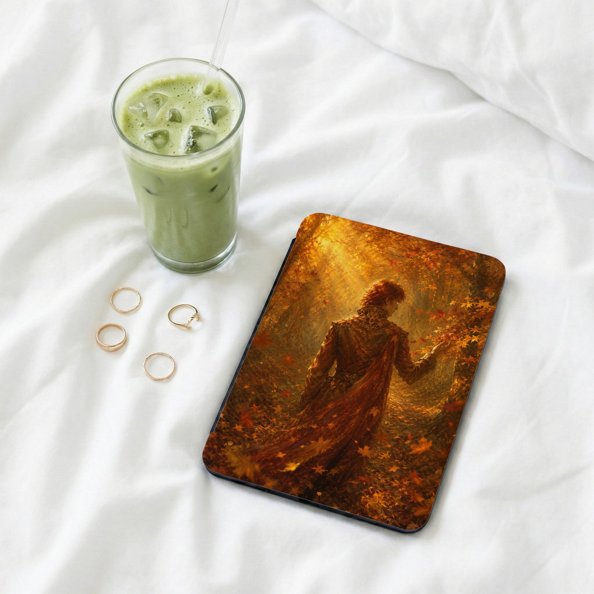 Tablet case with a fantasy art print of a person in an autumnal forest.