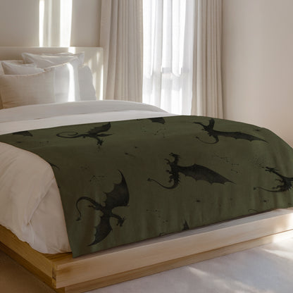 Bed runner with black dragon and constellation pattern on green fabric.
