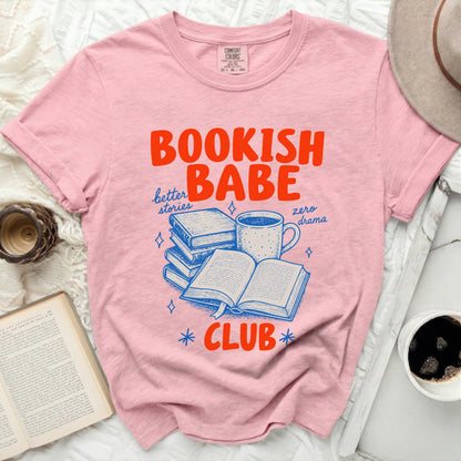 Pink t-shirt with "Bookish Babe Club" graphic featuring books and coffee.