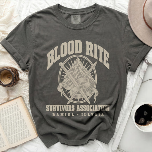 Charcoal crewneck t-shirt featuring the text "BLOOD RITE SURVIVORS ASSOCIATION RAMIEL ILLYRIA" and crossed swords over a mountain graphic.