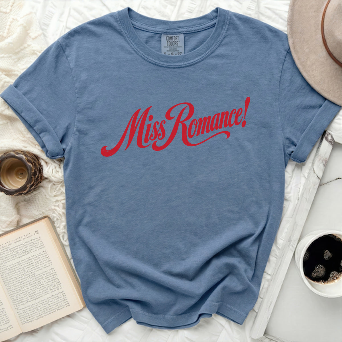 Comfort Colors t-shirt with red "Miss Romance!" graphic and rolled sleeves.
