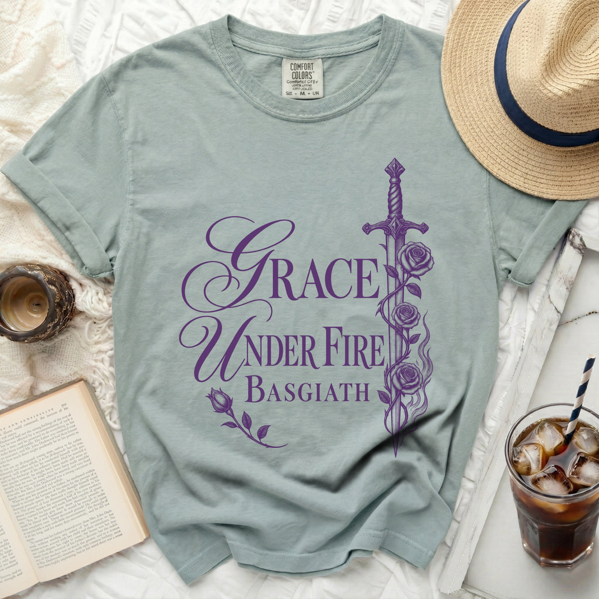 Sage t-shirt with purple "Grace Under Fire Basgiath" text and sword graphic.