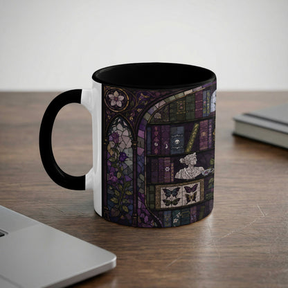 White mug with black handle featuring stained glass pattern of books, roses, and butterflies.