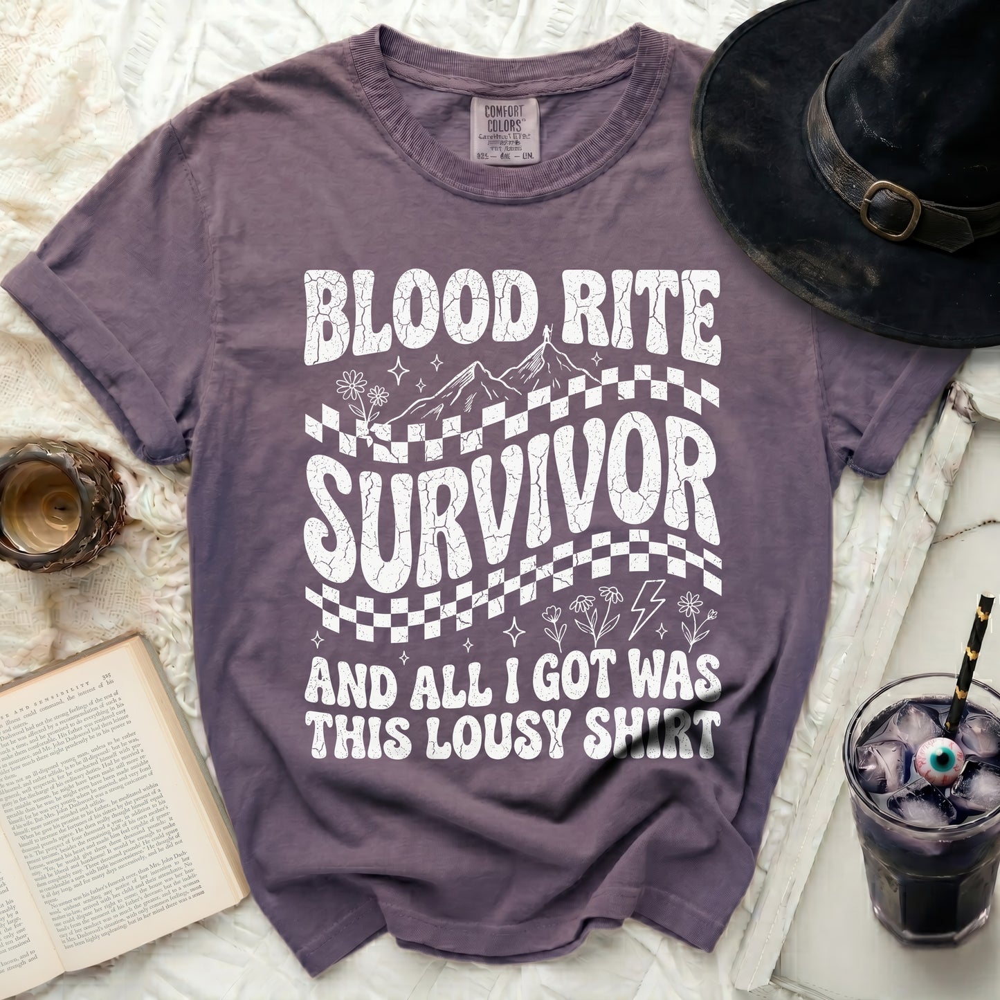 Purple t-shirt with "Blood Rite Survivor and all I got was this lousy shirt" graphic.
