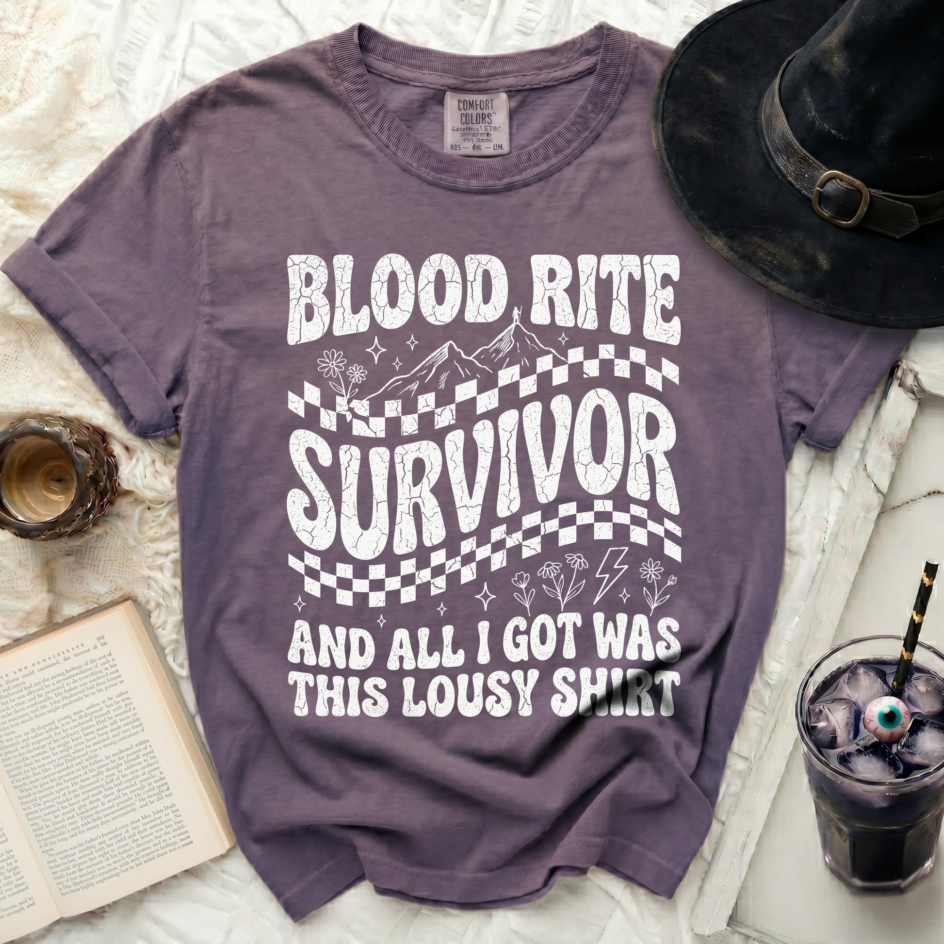 Purple t-shirt with "Blood Rite Survivor and all I got was this lousy shirt" graphic.
