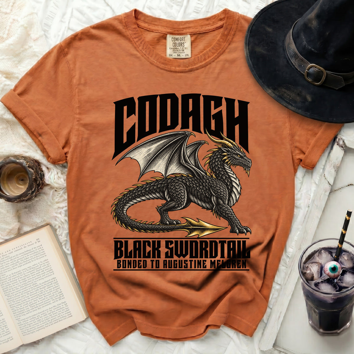 Orange t-shirt with black dragon graphic and text "Codagh Black Swordtail".