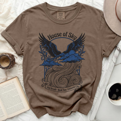 Brown t-shirt with "House of Sky And Breath Book Two Crescent City" text and eagle graphic.