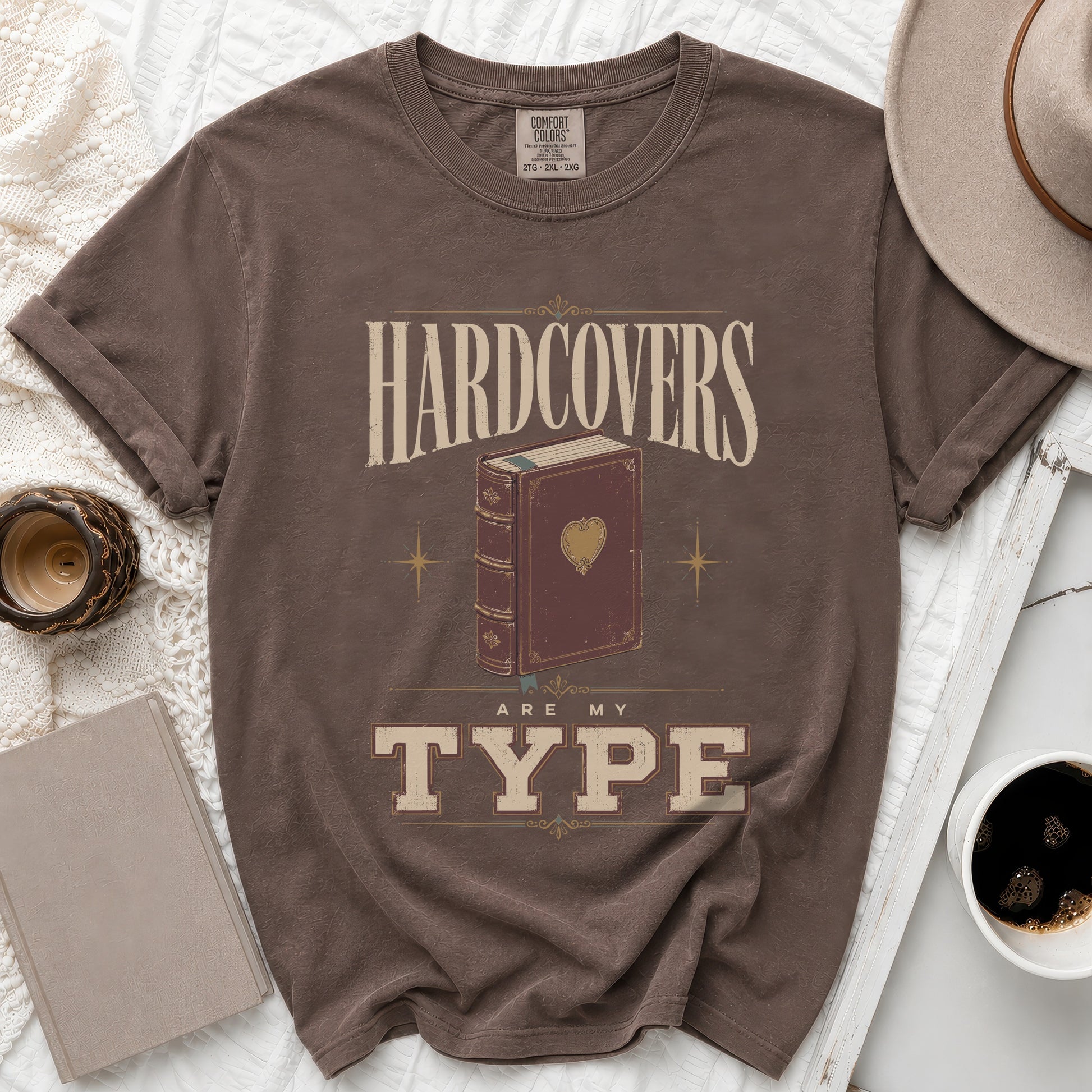 Brown t-shirt with "Hardcovers Are My Type" text and book graphic.