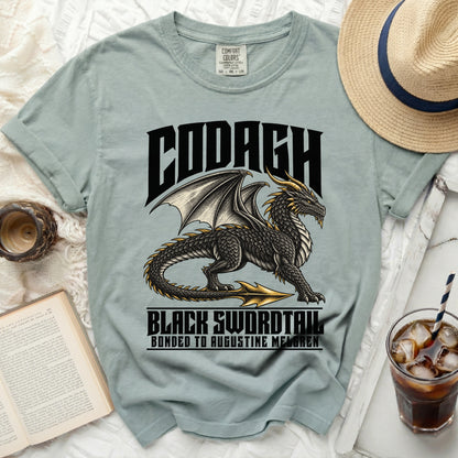 Light blue t-shirt with black dragon graphic and text CODAGH BLACK SWORDTAIL.