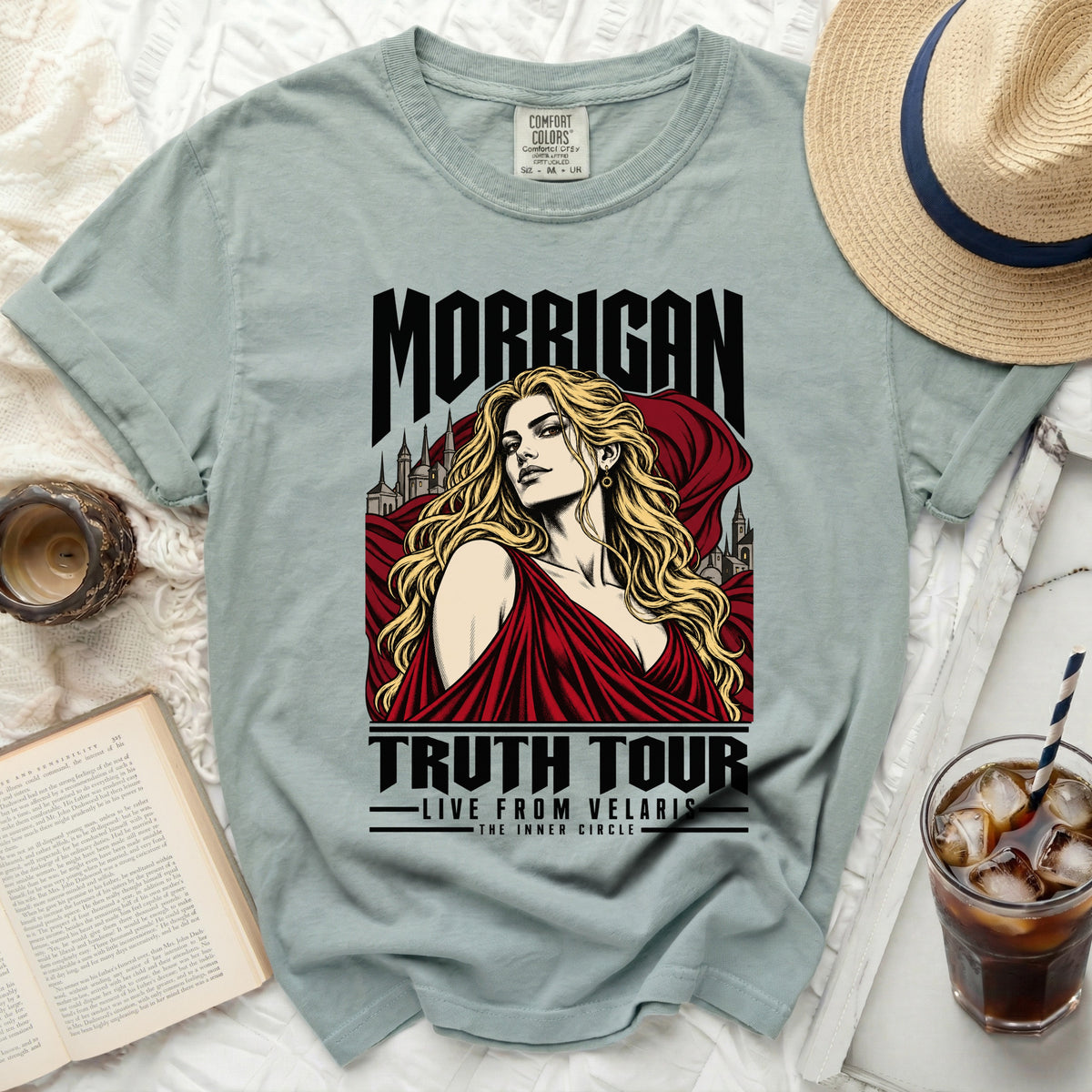 Green t-shirt with "Morrigan Truth Tour Live From Velaris" graphic.