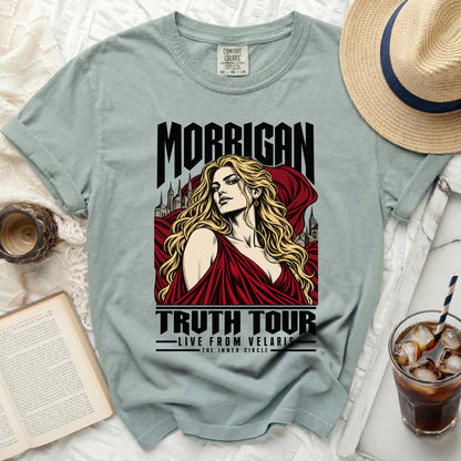 Green t-shirt with "Morrigan Truth Tour Live From Velaris" graphic.