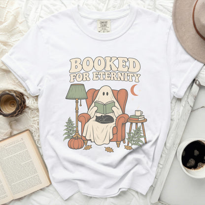 White t-shirt with "Booked For Eternity" graphic featuring a ghost reading.