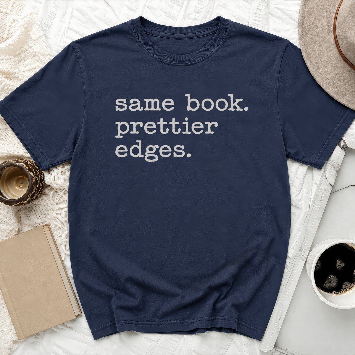Navy t-shirt with "same book. prettier edges." text in gray.