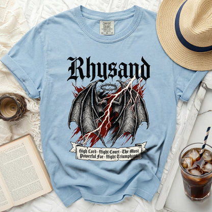 Light blue t-shirt with Rhysand, dragon wings, crown, and lightning graphic.