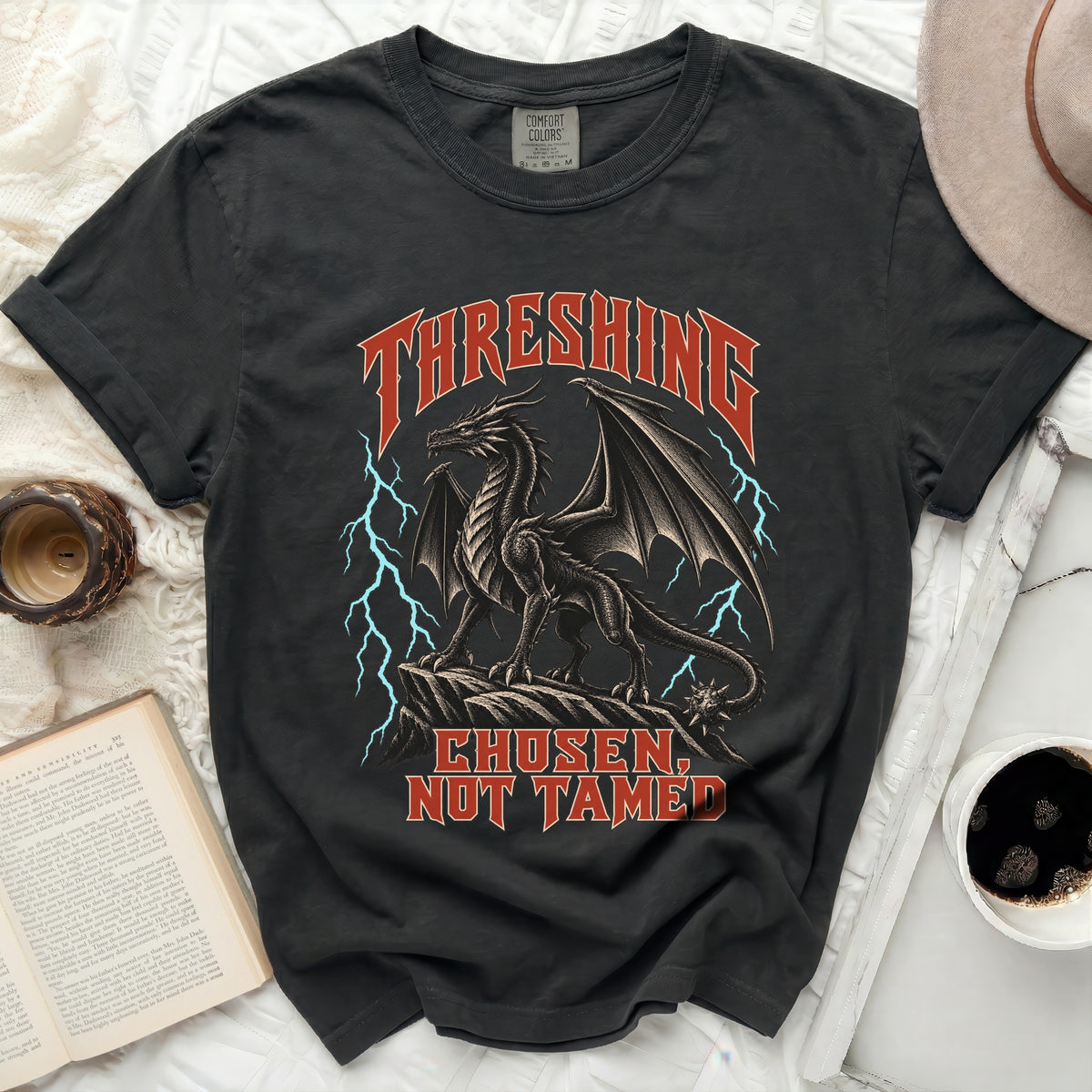 Black t-shirt with a dragon graphic and text "THRESHING CHOSEN, NOT TAMED".