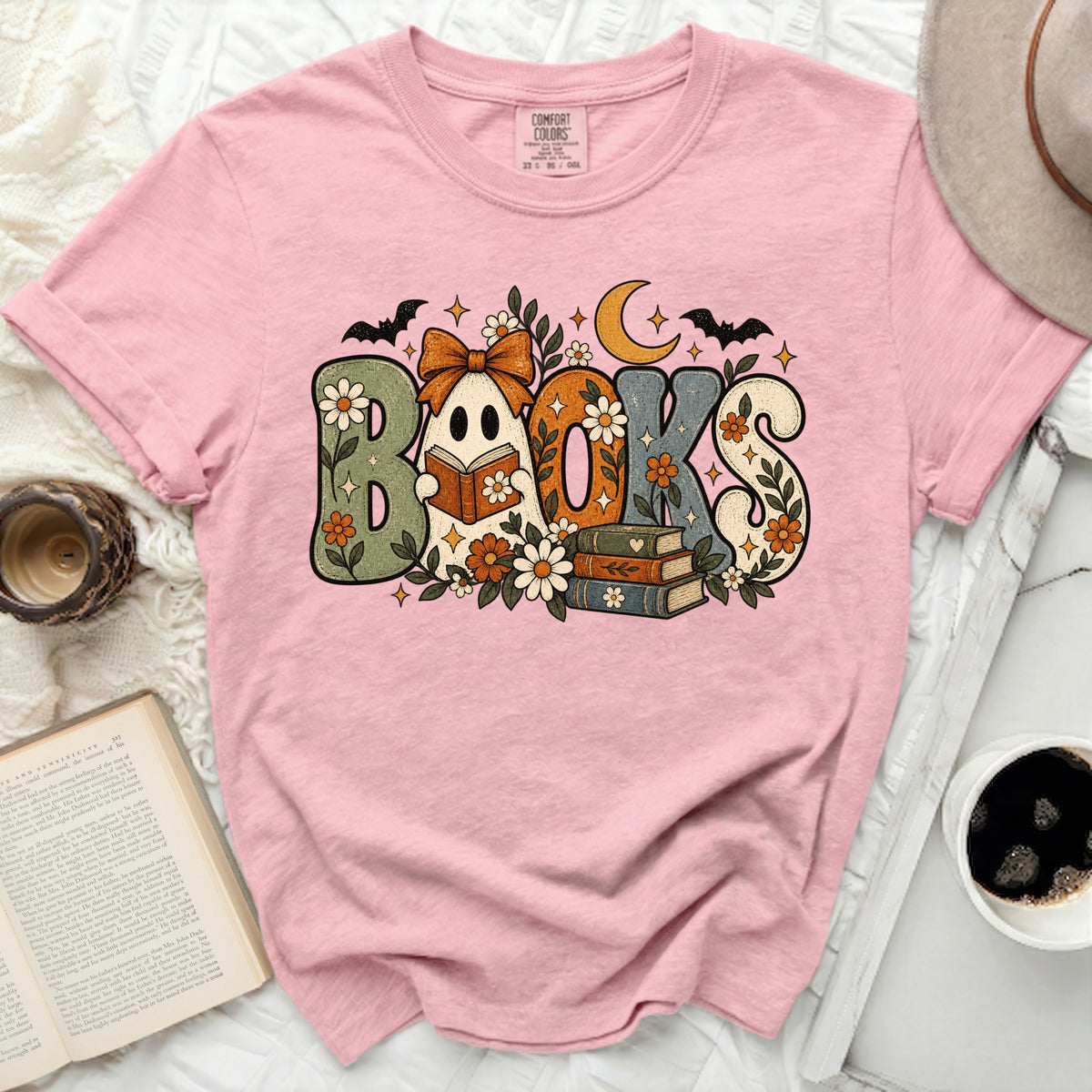 Pink t-shirt with retro "Books" graphic featuring a ghost reading.