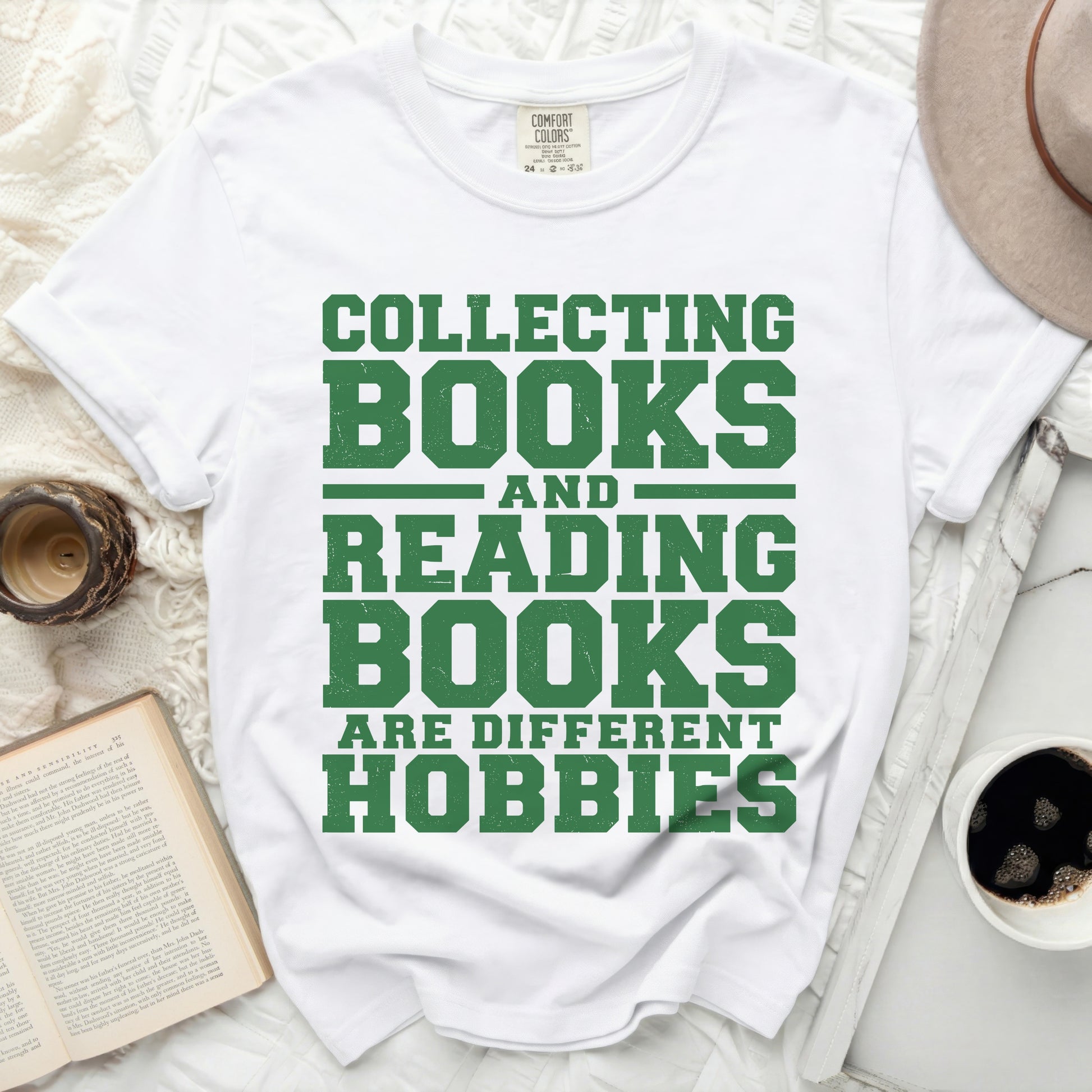 White t-shirt with green text: "Collecting Books and Reading Books Are Different Hobbies".