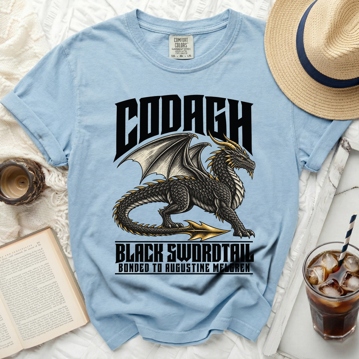 Light blue t-shirt with black dragon graphic, "CODAGH," and "BLACK SWORDTAIL."